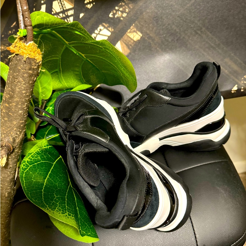 Black & white Micheal kors sneakers. Only were once, in brand new like condition